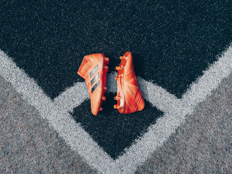 现代化直播控制中心内部，技术人员正在监控多个大屏幕上的足球比赛画面